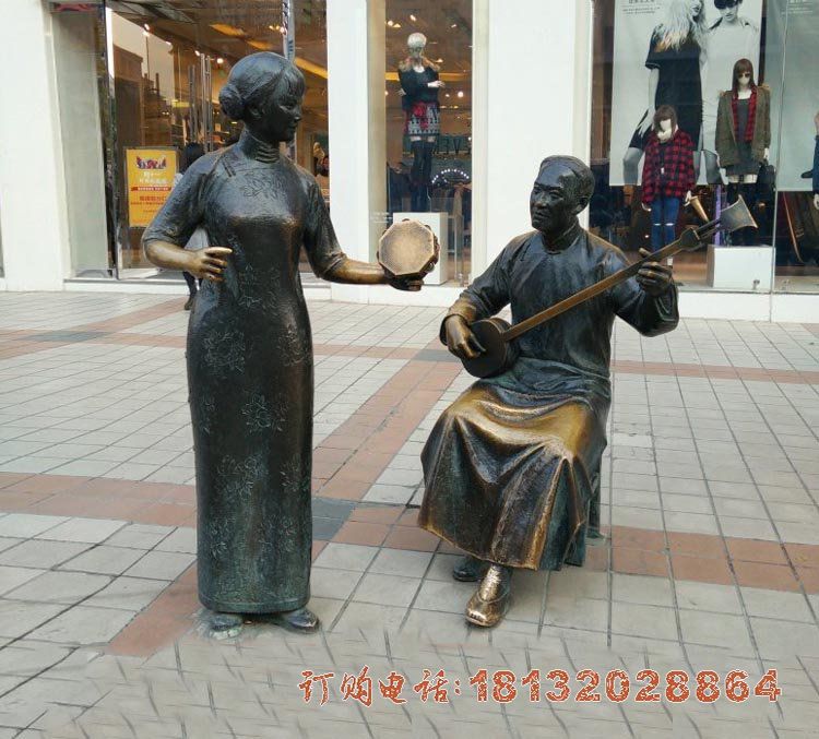 步行街弹三弦人物铜雕